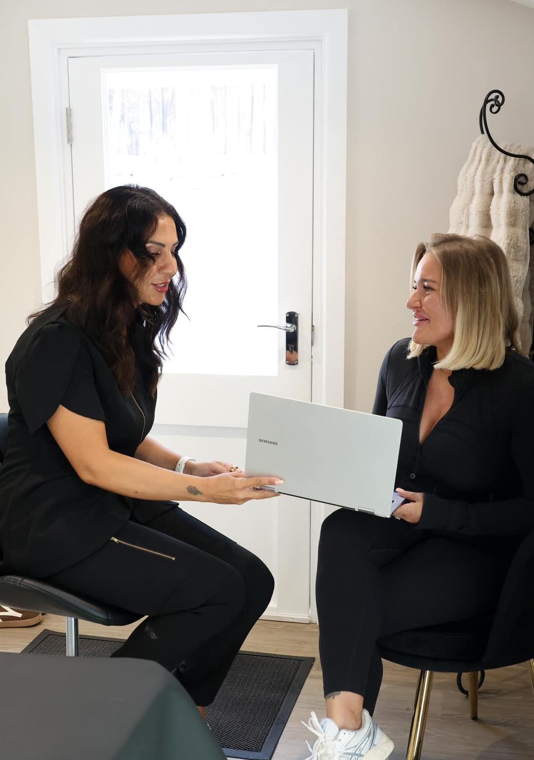 Safina Young talking a client through treatment options at her private Bracknell studio, about five miles from Sandhurst