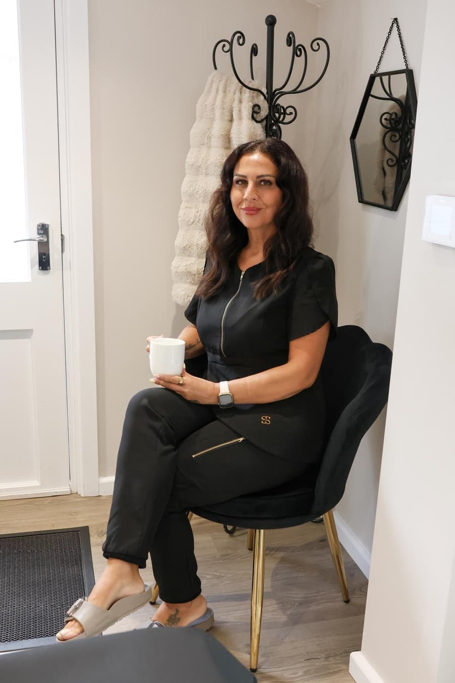 Safina Young seated in the welcome area of her private Bracknell studio